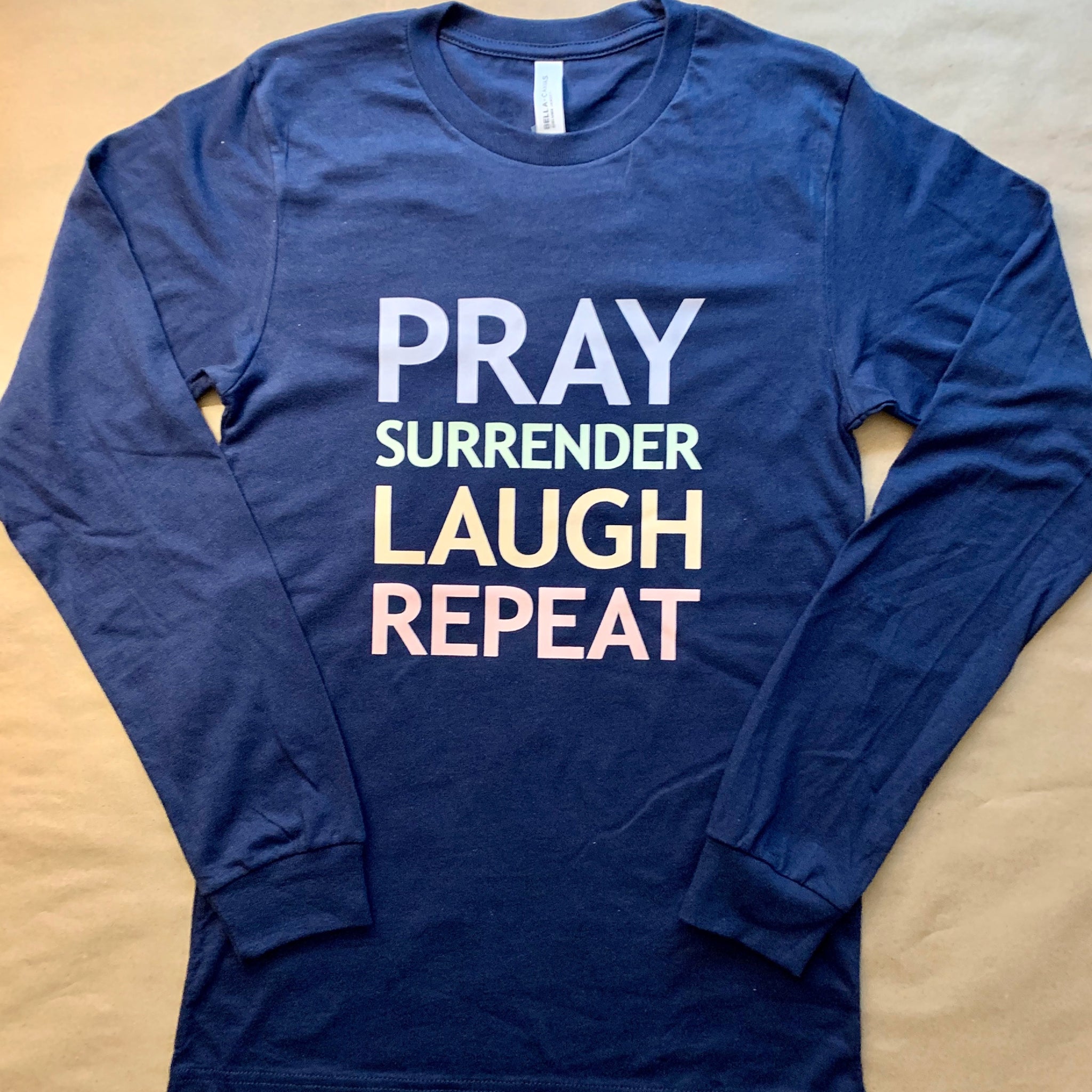 Pray, Surrender, Laugh, Repeat Tee ONE S LEFT